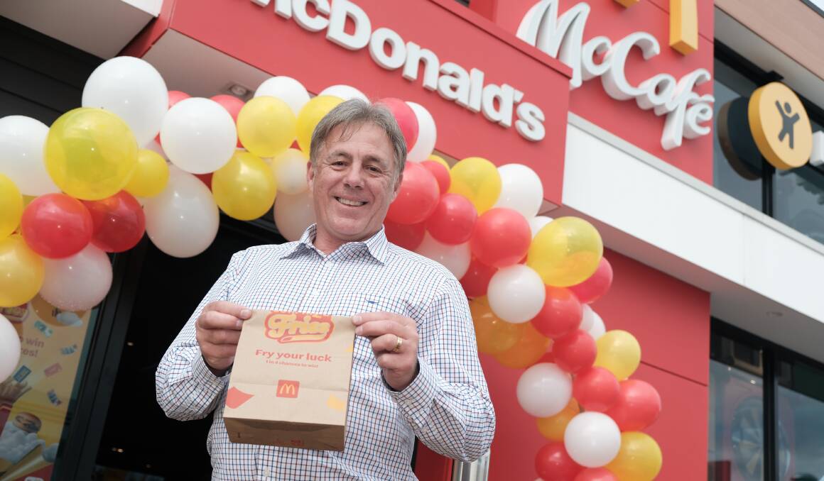 McDonald's West Bathurst licensee Todd Bryant holding a bag of goods outside the new resturant that opened on Monday. Picture by James Arrow.
