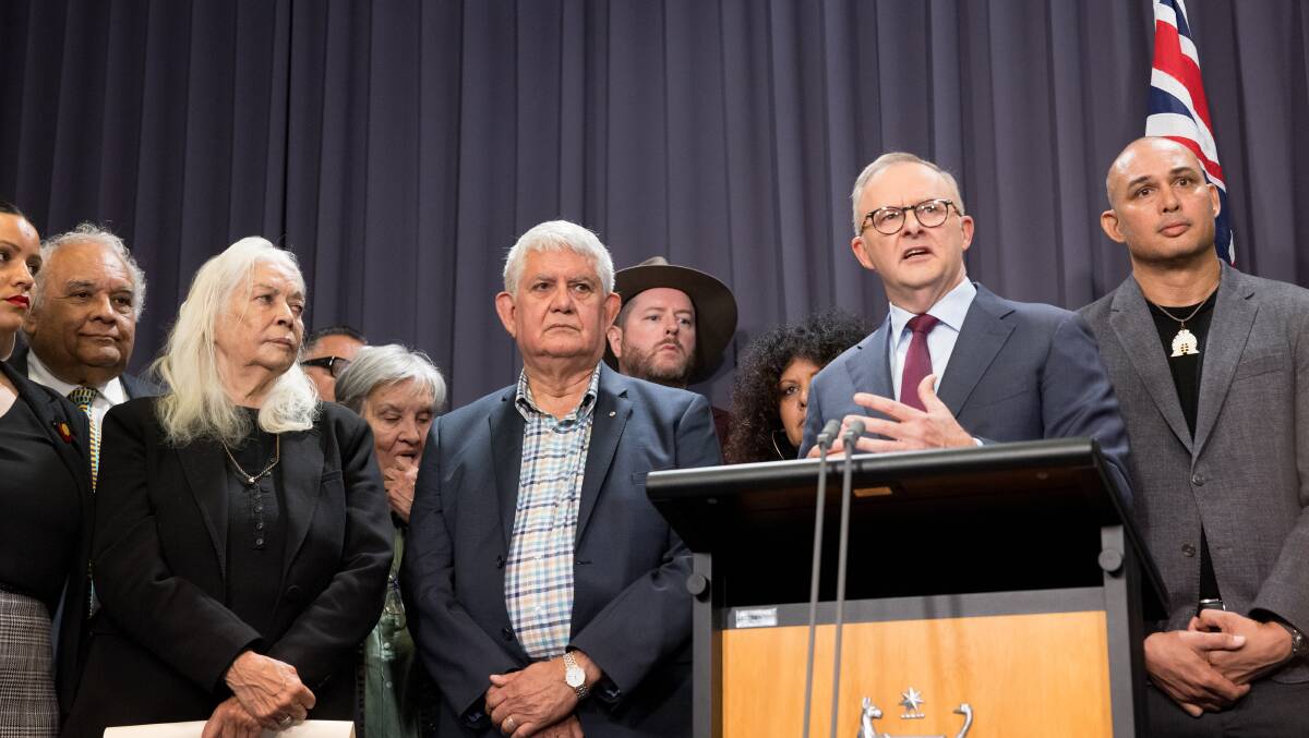 Members of the referendum working group stand with Prime Minister Anthony Albanese to unveil the draft wording of the question and Voice to Parliament draft constitutional alterations. Picture by Sitthixay Ditthavong
